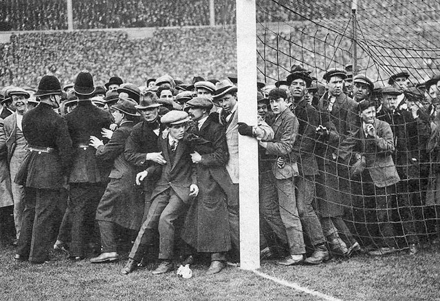 The crowd spills onto the pitch at the White Horse Final (1923)