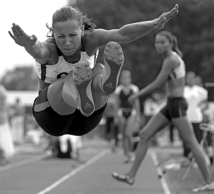 athlete performing a long jump